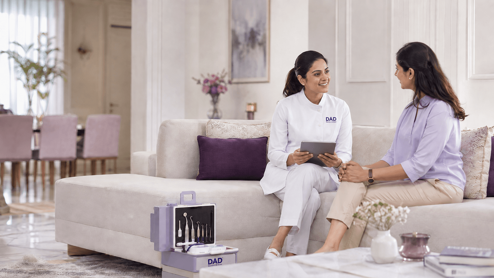 Dental professional speaking with a patient during a home consultation